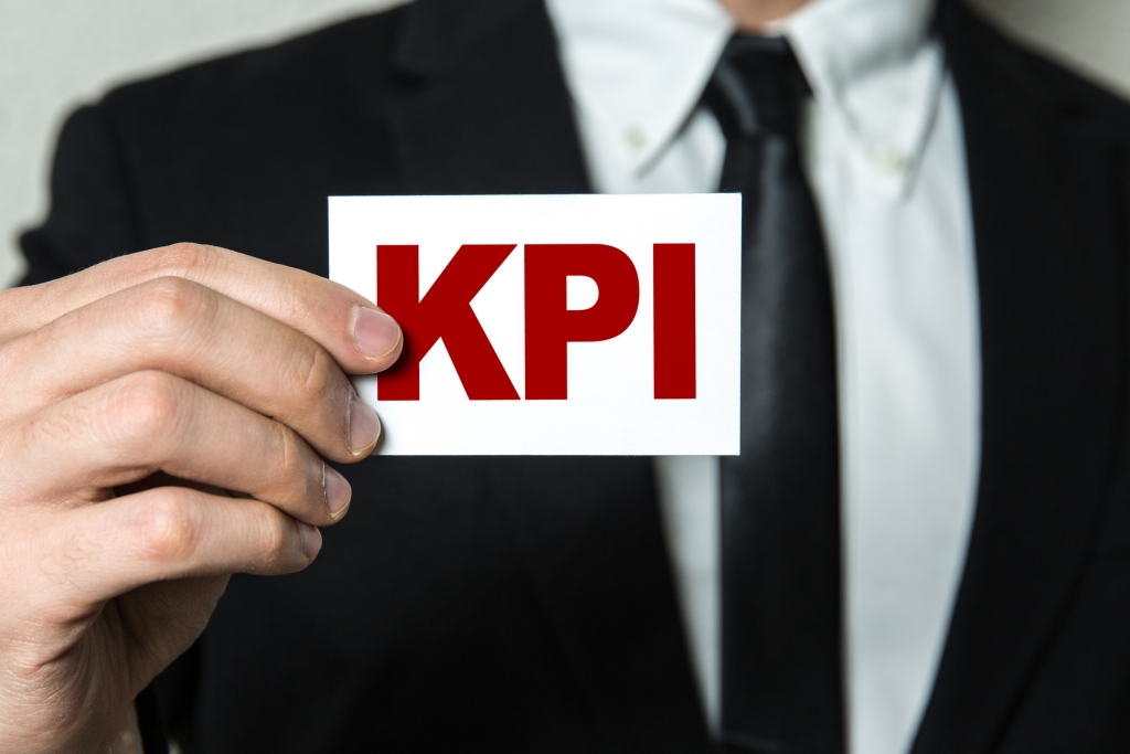 Man holding card in hand that says KPI