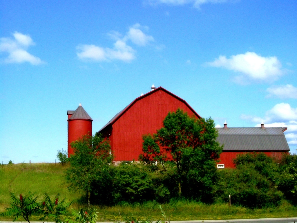 Red barn with farm landscape