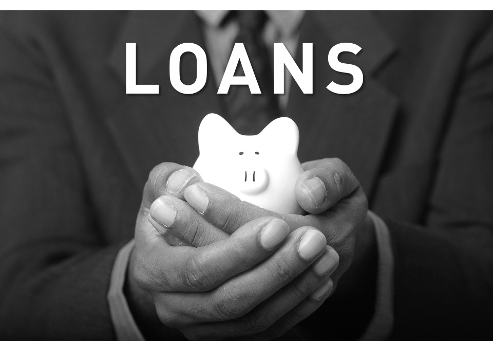 person holding piggy bank in hands and the word loans above
