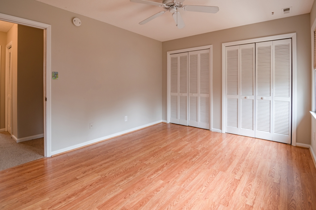 empty bedroom, hardwood floors and plain walls