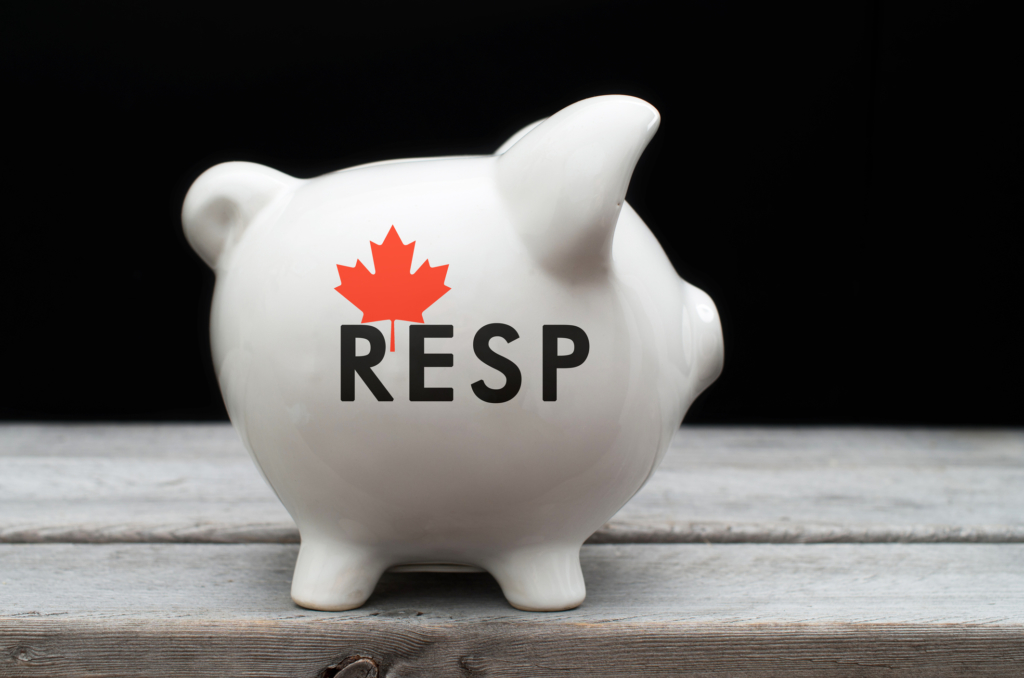Canadian Registered Education Savings Plan, RESP concept with white piggy bank
