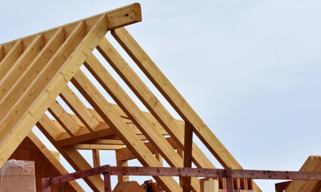 Home construction, wooden roof structure against the sky as the backdrop