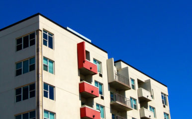 black, white and red apartment building