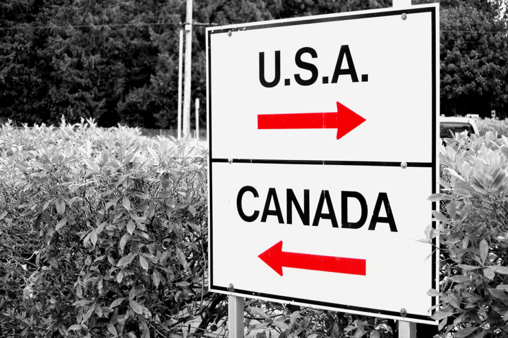 A shot of a sign at the US/Canadian border