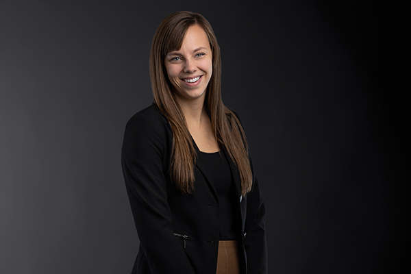 Professional photo of Danielle Vander Vegte standing in front of a black gradient background