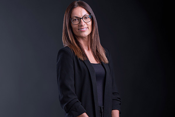 Professional photo of Dragana Trajkovic standing in front of a black gradient background