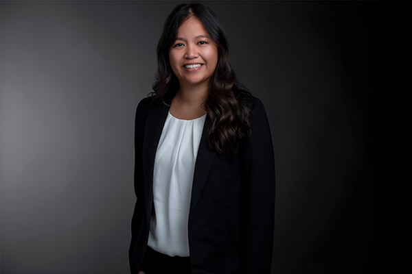 Professional Photo of Kaitlyn Joaquin standing in front of a black gradient background
