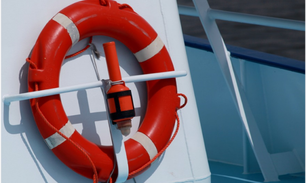 A lifebelt attached to the side of a white boat