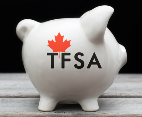 White piggy bank with a Canadian maple leaf and the word TFSA written in black