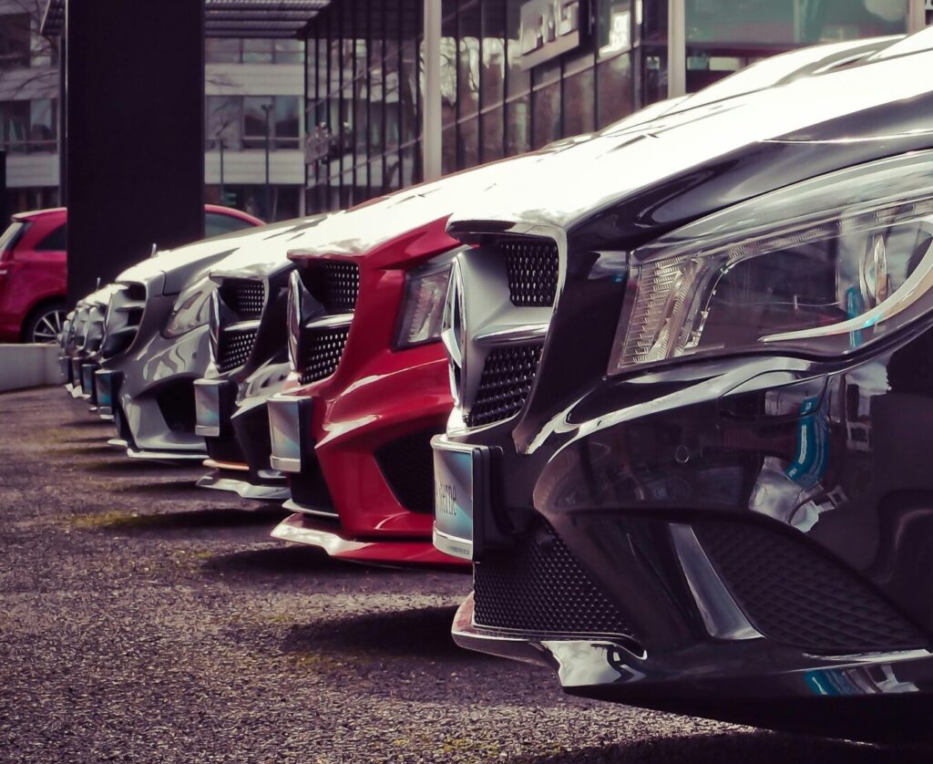 close up of a row of Mercedes in a car lot