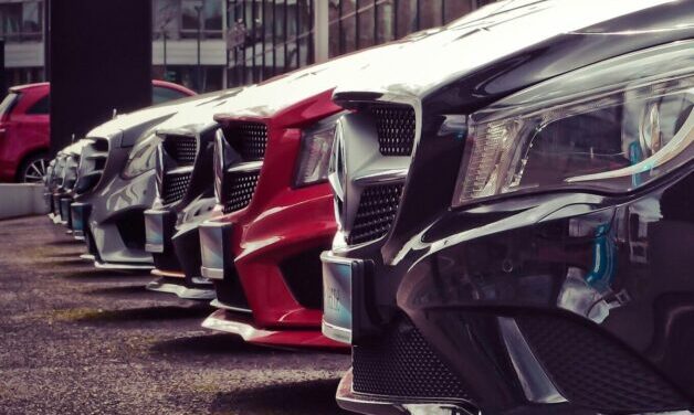 close up of a row of Mercedes in a car lot