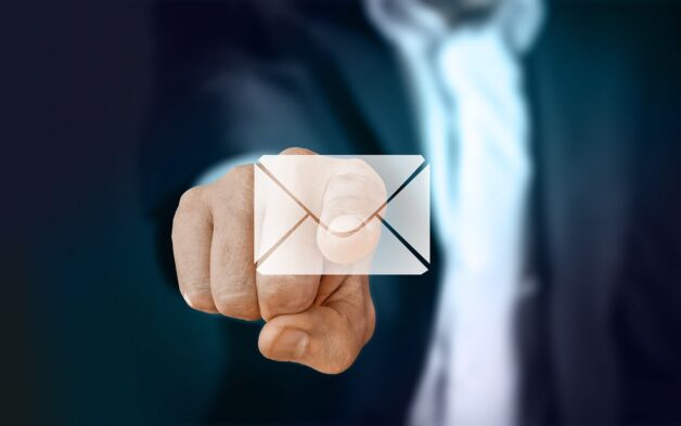 business mail pointing at electronic mail symbol