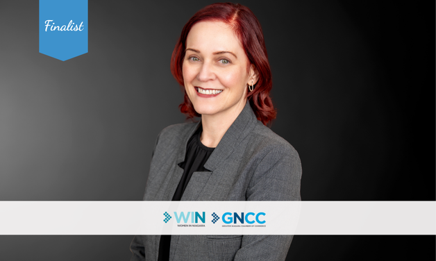 Professional photo of Christina Atkinson with the word finalist in a blue ribbon. The GNCC & WIN logos are also on the image.